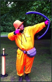 Circus Skills girl firing a balloon model arrow 